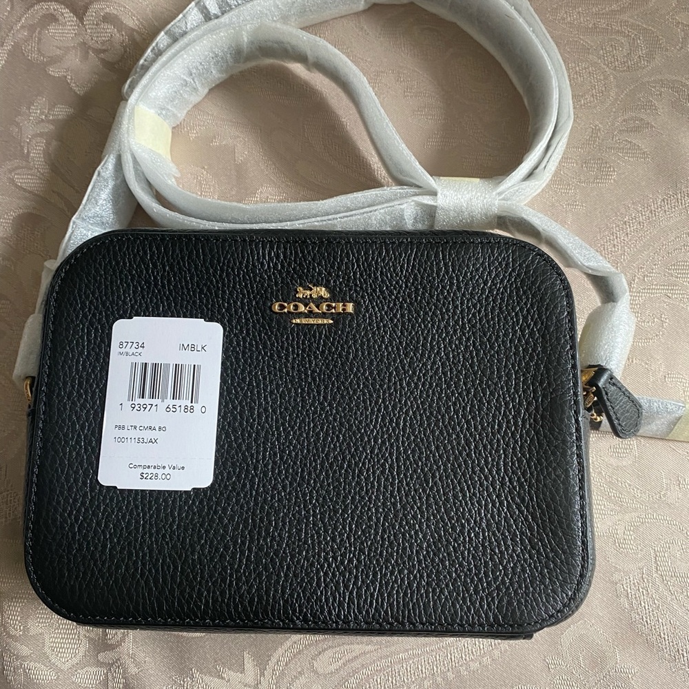 Black Coach Camera Bag. Never used. Dimensions in photos. Paid $109.00.